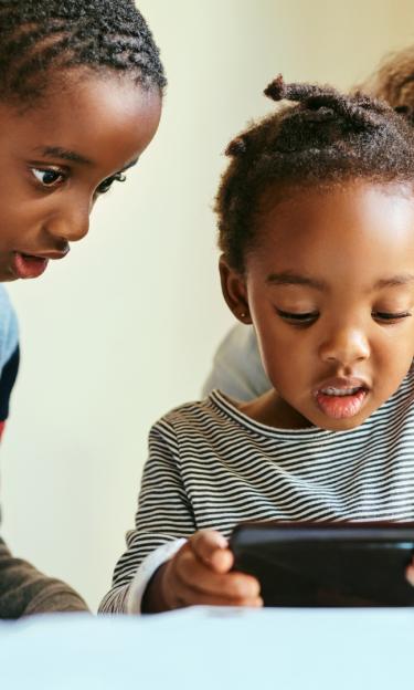 family learning on a tablet